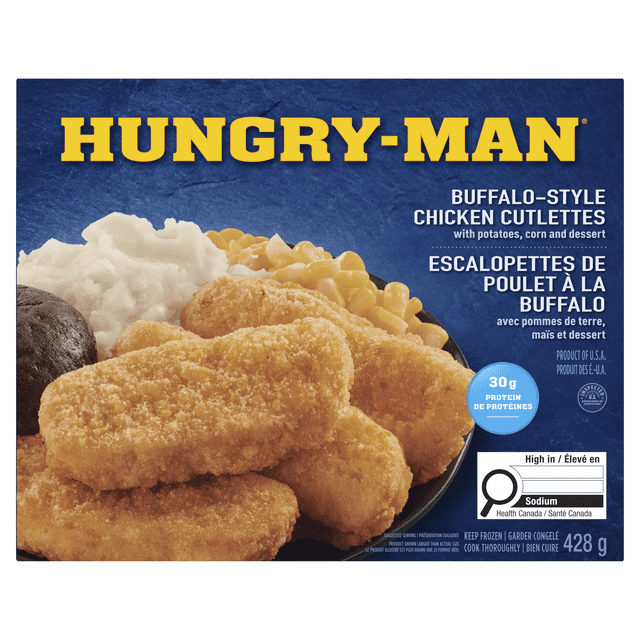 Hungry-Man Buffalo Style Chicken Strips frozen meal featuring breaded buffalo-style chicken cutlettes with creamy mashed potatoes, corn, and a chocolate brownie on a black plate, 428 g package with nutrition details including 30 g protein and high sodium content.