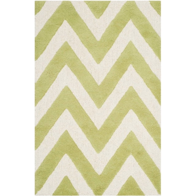 Safavieh Cambridge Kaitlyn Zig Zag Stripes Area Rug with hand-tufted wool construction, featuring a light green and off-white zig zag stripe pattern in plush cut and textured high/low loop piles, ideal as a durable accent rug for home or office.