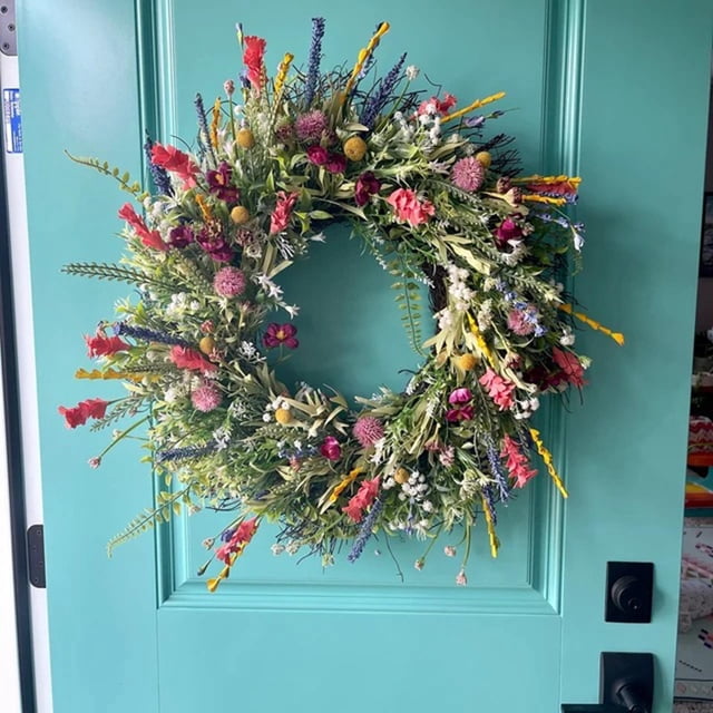 Spring and Summer Wreath Door Wreath, Home Decor Artificial Flower 40cm displayed on a teal front door. This artificial wreath features colorful gypsophila, vibrant flowers, and lush greenery arranged in a circular design. Ideal for spring decor, it enhances doors, fireplaces, walls, and windows during festivals, weddings, and parties.