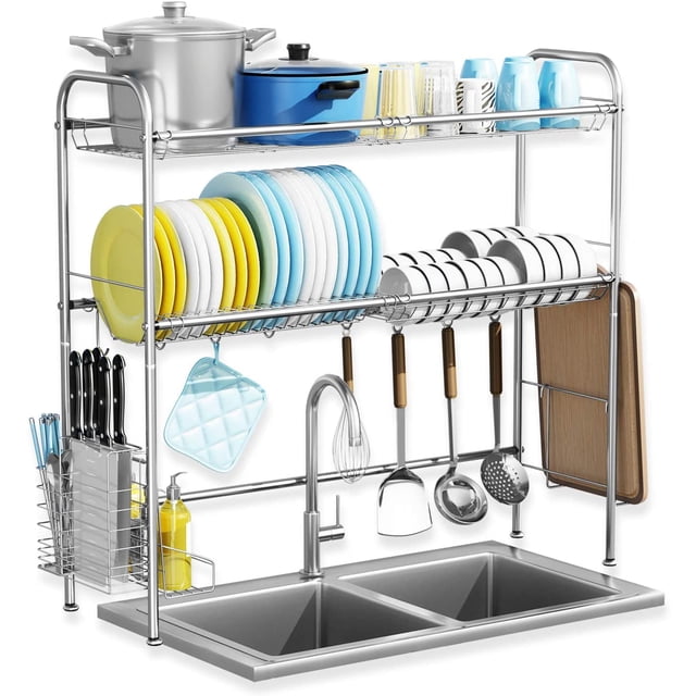 Over The Sink Dish Drying Rack, 2 Tier 304 Stainless Steel Dish Rack in silver with utensil holder, cutting board holder, and multiple storage baskets. Designed to fit over a double sink, featuring hooks, knife holder, and space-saving organization for kitchen counters. Ideal for maximizing countertop space and keeping utensils dry and accessible.