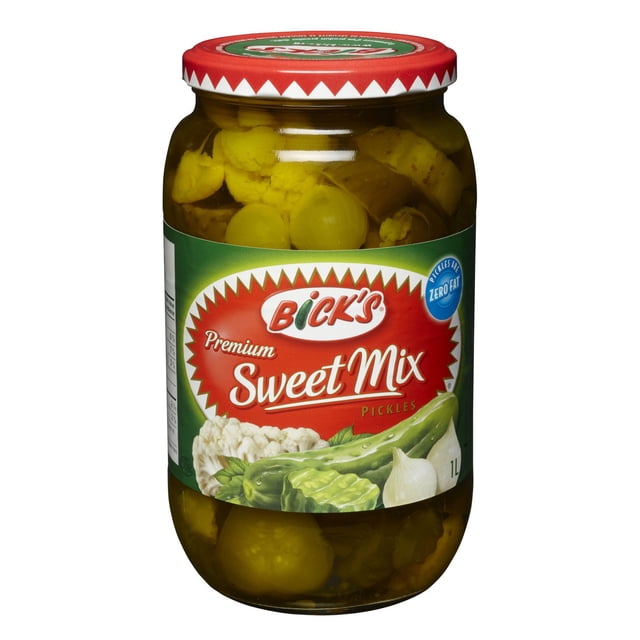 Bick's Sweet Mix Pickles 1L jar with clear glass showing a sweet vegetable medley of cauliflower, onions, and pickle chunks in sweet brine, featuring a red lid and green-red label noting zero fat and premium quality, ideal as a condiment or side dish.