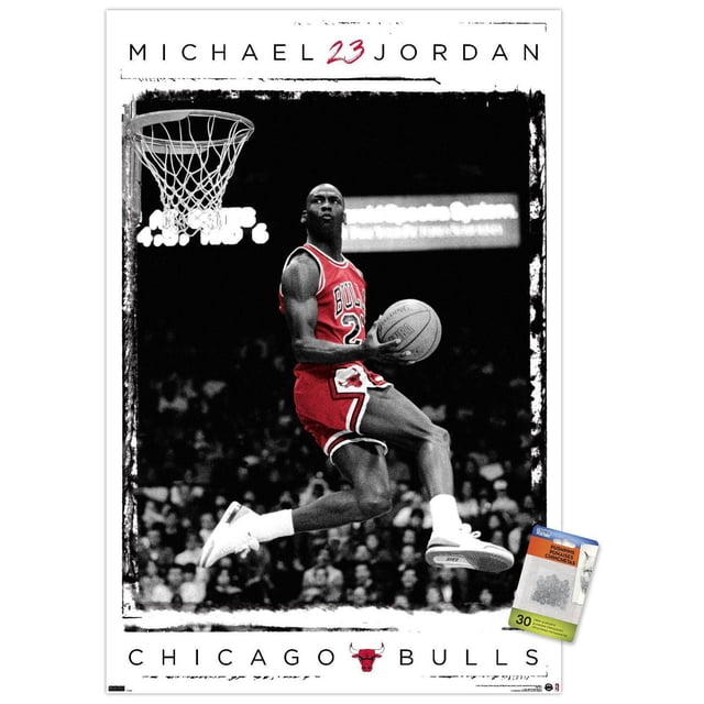 Michael Jordan - Dunk Wall Poster, 14.725" x 22.375" Framed showing Michael Jordan in a red Chicago Bulls uniform mid-air performing a basketball dunk with the ball in his right hand, set against a black and white crowd background with a white border featuring his name, number 23 in red, and the Chicago Bulls logo at the bottom, ideal for sports-themed wall art.