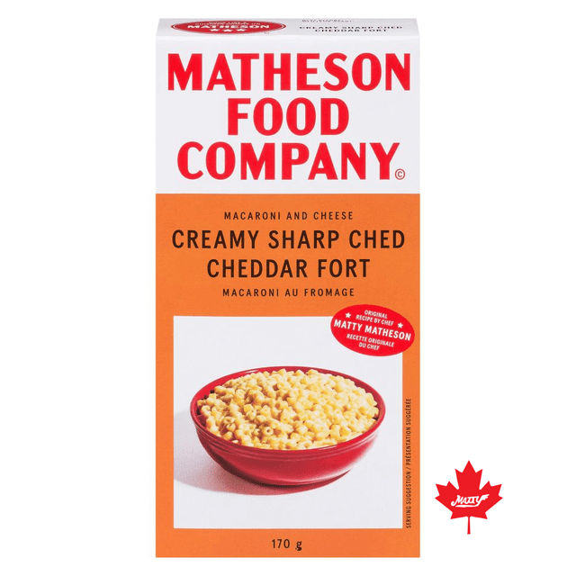 Macaroni au Fromage Crémeux fort cheddar Affûté par Matheson Food Company, Boîte de 170 g Montrant un Bol Rouge de Macaroni Crémeux avec Fromage cheddar Affûté, Recette Originale du Chef Matty Matheson, Prêt en 6 minutes, un Accompagnement de Pâtes Instantanées Audacieux et Acidulé Convenant aux Repas Rapides.