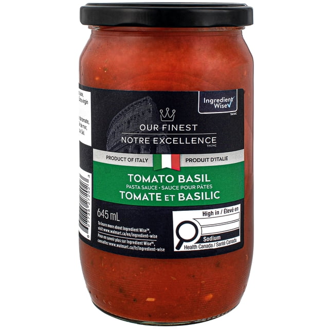 Our Finest Tomato Basil Pasta Sauce in a 645 ml resealable glass jar with a black lid, featuring a green and black label indicating it is a product of Italy, seasoned with basil, garlic, and onions, ideal for Italian pasta dishes, and marked high in sodium by Health Canada.