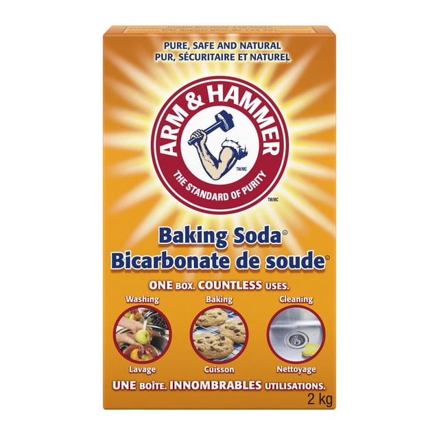 Arm & Hammer Pure Baking Soda 2kg box with bright orange background featuring the red and white Arm & Hammer logo with a muscular arm holding a hammer, described as a natural, multi-purpose cleaner and odour eliminator for washing, baking, and cleaning in English and French.