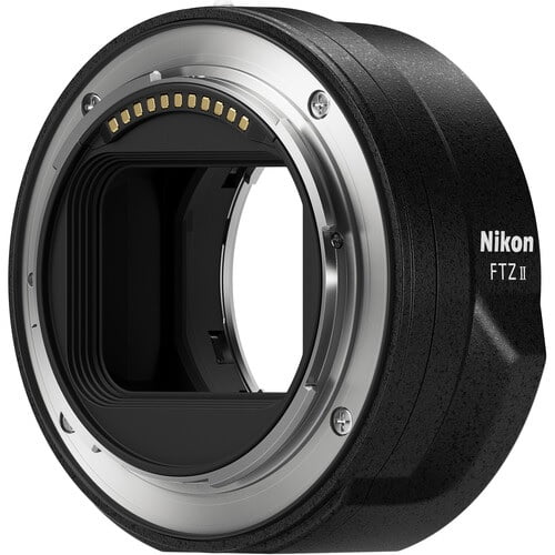 Nikon Mount Adapter FTZ II, a streamlined lens mount adapter for connecting F-Mount lenses to Z series mirrorless cameras. Features a durable black exterior, visible electronic contacts for autofocus and image quality retention, and weather-sealed construction for reliable performance.