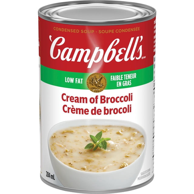 Campbell's Low Fat Cream of Broccoli Condensed Soup, Shelf Stable, 284 ml can with red and green label featuring the Campbell's logo and low fat claim, showing creamy broccoli soup garnished with a sprig of green herb, ideal for quick pantry meals.