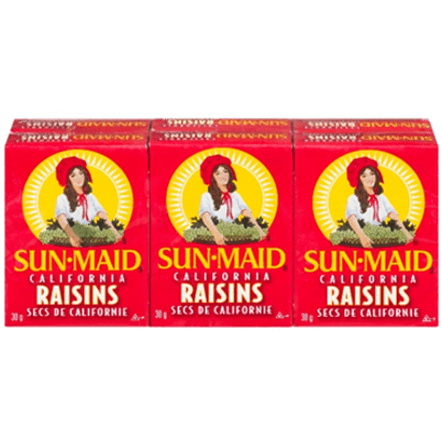 Sunmaid Raisins Boxed showing three red rectangular boxes side by side, each with the Sun-Maid logo featuring a woman in a white blouse and red bonnet holding a basket of grapes, labeled California Raisins and Secs de Californie, a better-for-you dried fruit snack suitable for breakfast toppings or on-the-go snacking.