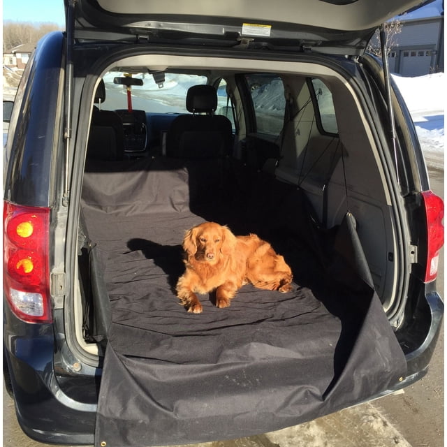 Cargo Liner Small Vehicle Cargo Liner installed in the rear cargo area of a black SUV with the hatch open, featuring a black protective liner covering the floor and back of the rear seats, with a golden brown dog lying on it, suitable for protecting vehicle interiors from dirt, pet hair, and debris.