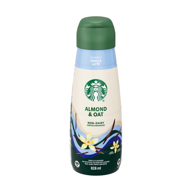 Starbucks Non-dairy Vanilla Coffee Enhancer almond and oat blend in an 828 ml bottle with green cap, featuring vanilla flower graphics, vegan certification, and designed as a coffee creamer alternative inspired by vanilla latte flavor for hot or iced coffee.