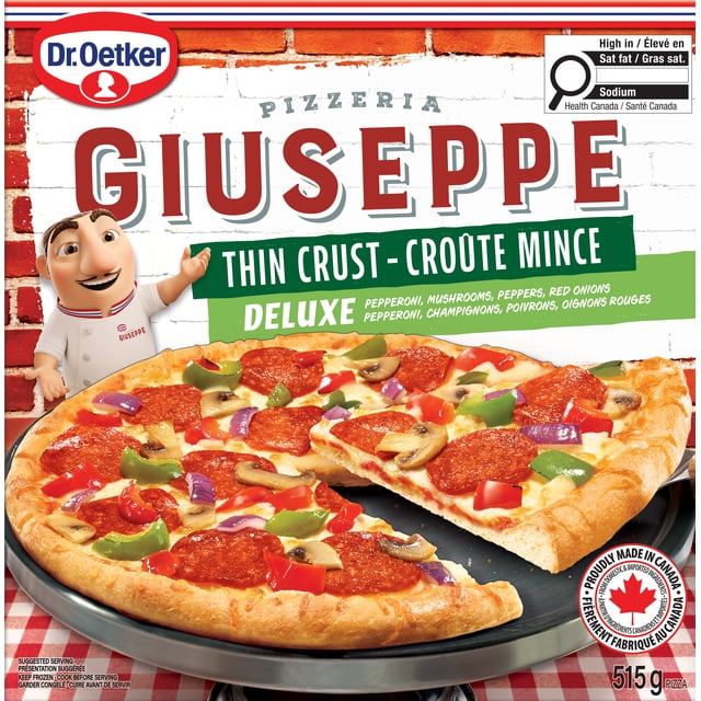 Dr. Oetker Giuseppe Pizzeria Thin Crust Deluxe Pizza showing a round thin crust pizza topped with pepperoni, mushrooms, red and green peppers, and red onions on a black pizza pan over a red and white checkered tablecloth, made in Canada weighing 515 grams.
