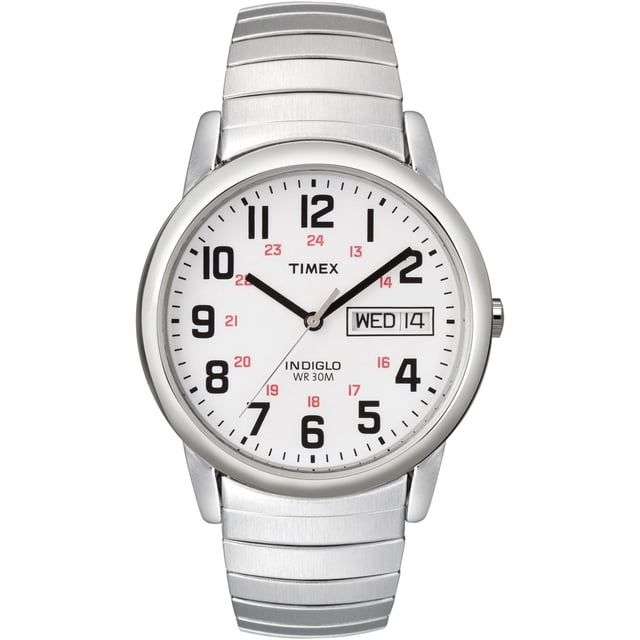 Timex® Easy Reader® Day Date Expansion Band Watch with 35mm polished silver tone case and extra long stainless steel expansion band. It features a white dial with large black Arabic numerals, red 24-hour markers, day-date window at 3 o’clock, INDIGLO light-up dial, and water resistance to 30 meters. Often used for reliable everyday timekeeping.