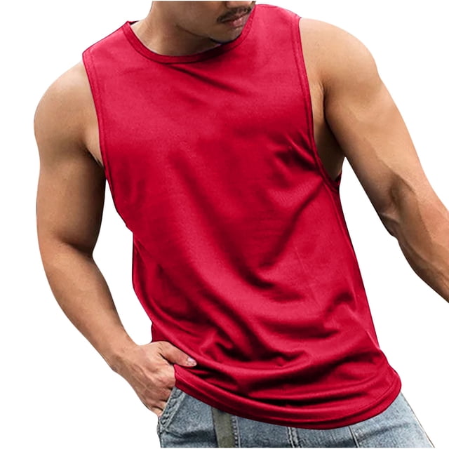 fatyb Mens Workout Tank Tops in a vibrant red color, featuring a sleeveless design and breathable polyester fabric. This athletic t-shirt is ideal for gym workouts, running, bodybuilding, or casual wear. The model is shown wearing the tank top paired with denim shorts, highlighting its lightweight and comfortable fit.