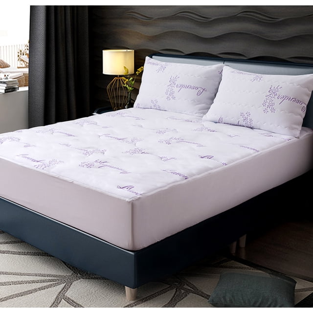 Nola Home Mattress Protector Waterproof Knitted Lavender Treated, Twin size mattress cover, shown on a bed in a modern bedroom. The protector has a white surface with lavender-themed patterns and a fitted elastic skirt that accommodates mattresses up to 15 inches deep. It prevents fluids, dust mites, and allergens from contaminating the mattress while offering breathable comfort and a soothing lavender scent. Ideal for waterproof bedding and allergy control, it is machine washable for easy care.