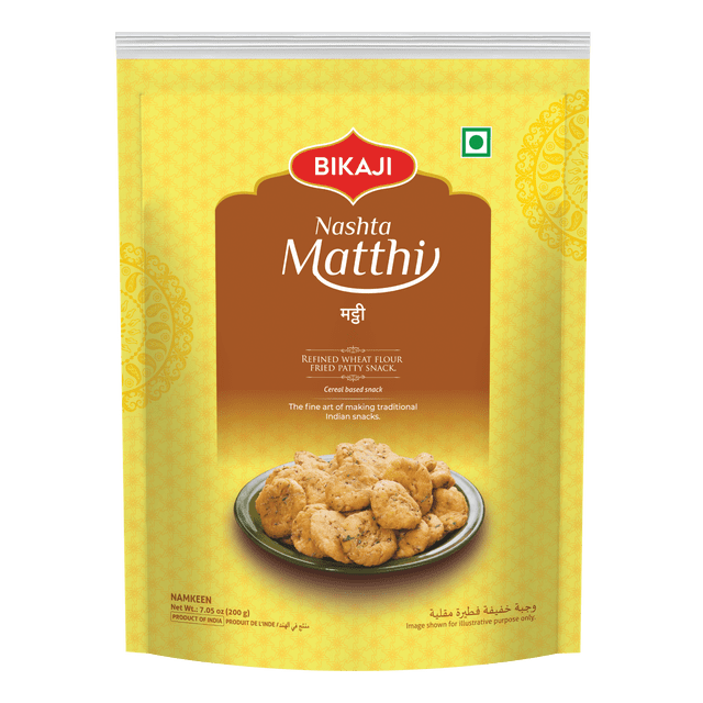 Bikaji Nashta Matthi 140g package with a yellow and brown design showing a plate of round, flaky, golden-brown fried wheat flour snacks seasoned with cumin and carom seeds, a traditional Indian savory snack often enjoyed with tea or pickles.
