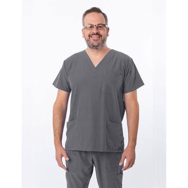 Greentown Canada Scrubs 4Flex 1202 Unisex Scrub Top in charcoal grey with V-neck and athletic fit, made from 93% polyester and 7% spandex featuring 4-way stretch and moisture-wicking fabric, tagless design, and three pockets, worn with matching scrub pants.