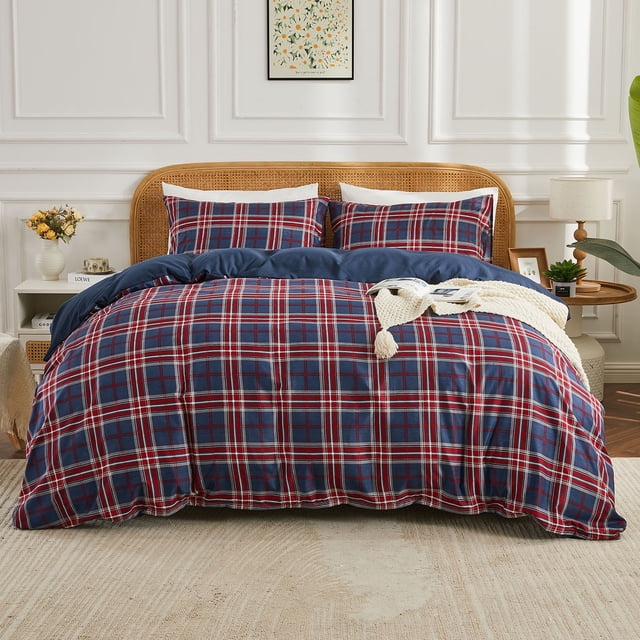 Gogreen Queen Duvet Cover Set with a red and blue plaid pattern, made from soft and breathable 90GSM microfiber with fade-resistant fabric and zipper closure. Includes one duvet cover and two pillowcases, displayed on a neatly made bed with a rattan headboard in a bright, elegant bedroom setting. Suitable for all seasons and machine washable.