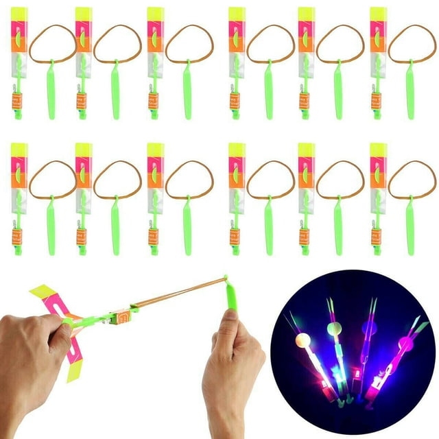 12Pcs Amazing LED Light Helicopter Flying Toy Elastic Slingshot Flying Copters, featuring colorful plastic construction and built-in LED lights. The set includes 12 flying toys with random colors, each approximately 16.7 cm in size. Designed for nighttime play, these toys can fly up to 20 feet high and slowly rotate while falling, creating a vibrant display. The image shows the toys arranged in rows, with a close-up of the slingshot mechanism and a glowing effect in the dark.