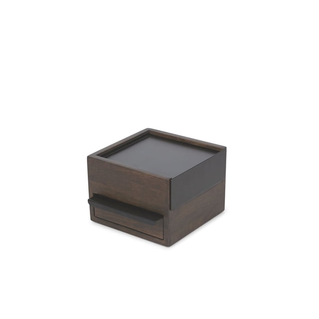 Umbra Mini Stowit Jewelry Box in black and walnut with a compact square shape, featuring a dark walnut wood base, matte black top tray with raised edges, and a front drawer with a black handle. Designed to organize rings, earrings, and other jewelry, it suits dresser or desk placement and is also suitable for storing small accessories securely.