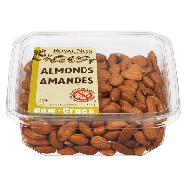 ROYAL NUTS ALMONDS RAW in a clear plastic container showing whole brown almonds with bilingual labeling including gluten-free and peanut-free icons, weighing 325g, suitable as a nut topping or healthy snack rich in fiber, protein, and vitamin E.