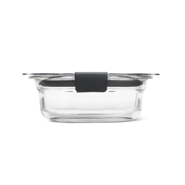 Rubbermaid Brilliance Glass Round Leak-Proof 1.7-Cup Food Storage Container shown in side profile with a clear, oven-safe glass base and transparent lid secured by a black dual-latch locking system for airtight, leak-proof storage, suitable for microwave and freezer use, often used for meal prep and leftovers.