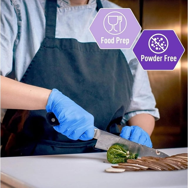 Daily Essen Nitrile Disposable Gloves 5 Mil Extra Strength, industrial grade, shown in use during food preparation. A person wearing a blue apron and blue nitrile gloves is slicing vegetables on a white cutting board. The gloves are latex-free, powder-free, and feature textured fingertips for a secure grip. Icons highlight food prep suitability and powder-free design.