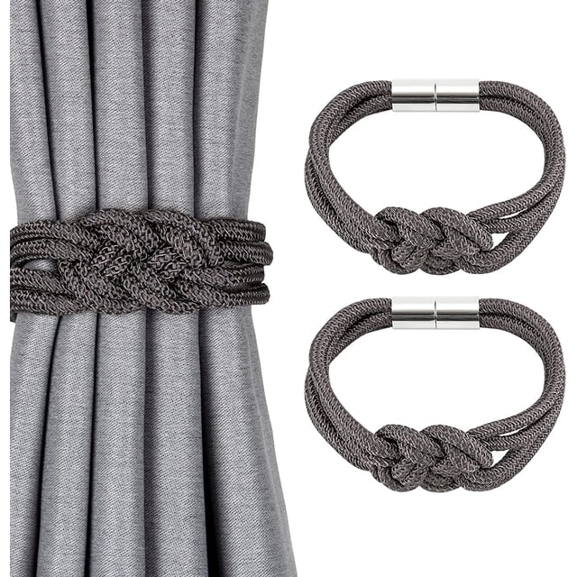 2 Pack Strong Magnetic Curtain Tiebacks in a Nordic simple style featuring a double-color weave rope knot design. The tiebacks are shown in a dark grey tone, with one securing a grey curtain and two displayed separately. Made of high-quality polyester with a smooth texture, these tiebacks include strong nickel-plated magnets for secure hold without drilling or wall damage. Suitable for various tying methods, including front-tied, back-tied, side half-tied, and knot-tied, they add a decorative and functional touch to home or office window drapery.