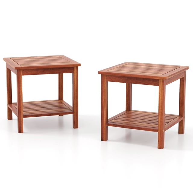 Gymax 2 Pieces Adirondack Outdoor Side Table set with two square, 2-tier tables crafted from natural acacia wood. Each table features a slatted design, weather-resistant finish, and open storage space for books, drinks, or decor. Compact and lightweight, suitable as patio accent tables or outdoor coffee tables for porches, decks, or poolside areas.