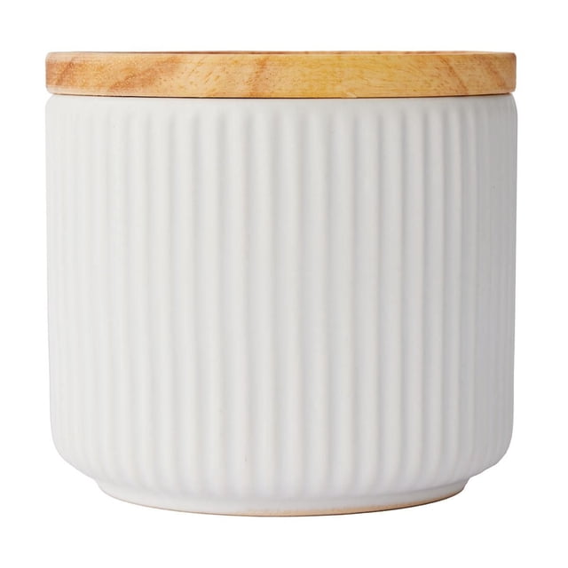 Anko Small White Ribbed Canister with a white ribbed ceramic body and natural wood lid, designed for storing kitchen essentials like coffee, tea, sugar, or snacks, dishwasher safe and suitable for organizing small pantry items.