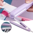 thumbnail image 1 of Oleegame 1PC Small Household Mini Portable Nougat Sealing Machine Snack Snowflake Packaging Bag Sugar Paper Plastic Sealing Machine Purple, 1 of 9
