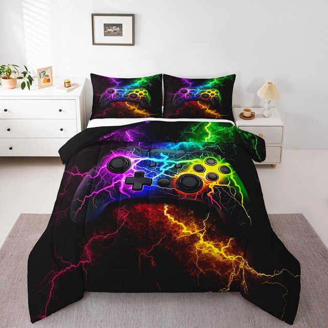 Kids Game Comforter Sets Queen Size, featuring a vibrant gaming controller design with multicolored lightning patterns on a black background. The set includes a 90x90-inch comforter and two 20x30-inch decorative pillowcases, crafted from ultra-soft materials. Displayed in a modern bedroom with white furniture and minimal decor, this bedding set adds a bold and playful touch to the space.