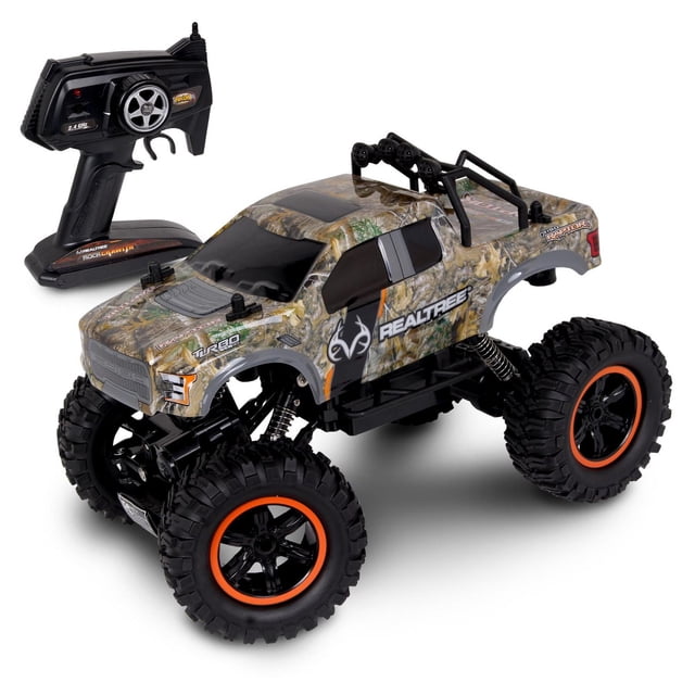 NKOK Realtree Ford F-150 Raptor 1/14 Scale RC Toy with camo Realtree body, black tinted windows, and large black off-road tires with orange rims, featuring 2.4 GHz pistol grip remote, real-time 4x4 drive, and high flex suspension, ideal for rock crawling and outdoor RC racing.