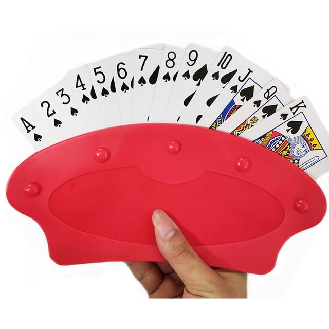 Hands-free Playing Card Holder by Elodie, made of thick durable ABS composite, shown in red with a fan of playing cards securely held. Designed for tabletop use or handheld convenience, it expands to fit at least 15 cards. Suitable for children, seniors, or individuals with limited dexterity. Dimensions: 21.5cm x 10cm. Also functions as a trading card deck box for organized storage.