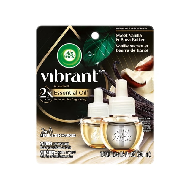 AIR WICK® SCENTED OIL - Refill - 0+2 Vibrant™ Almond Milk & Honey 6/(2x20) mL showing two clear glass refill bottles with white caps embossed with Air Wick logo, set against a black and gold background with almond and honey visuals, infused with 2x more natural essential oils for enhanced fragrance in air freshener refills.