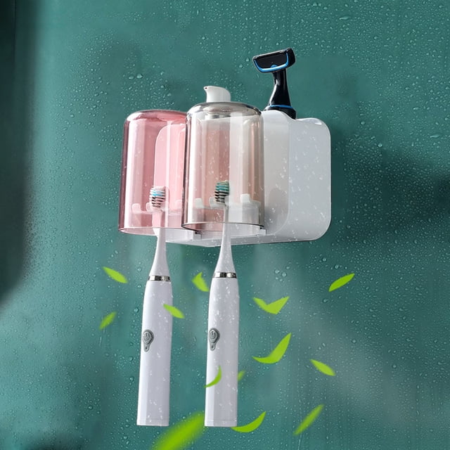 Dvkptbk Toothbrush Holder Toothbrush Cup Holder Set for Bathrooms, a wall-mounted organizer with a cup dispenser, toothbrush tray, and slots for toothbrushes and toothpaste. Made of durable white plastic, it includes two transparent cups and uses a strong adhesive strip for secure mounting on smooth surfaces like tile or glass.