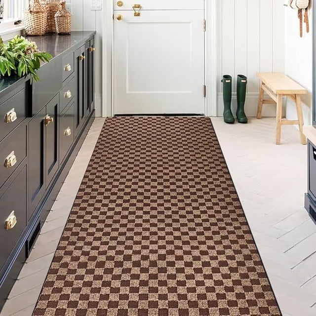 ANTPOP Runner Rug Outdoor Carpet Runners Hallway Non-Slip Rubberback Area Rugs Indoor Entrance Mat for Entryway Kitchen, 2'x6', Checkred Brown. A checkered brown runner rug with a low-profile pile and non-slip rubber backing, placed in a bright entryway with white walls and herringbone flooring. Ideal for high-traffic areas like hallways, kitchens, and foyers, this fade-resistant and stain-resistant rug adds style and functionality to any space.