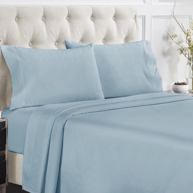 California Design Den Sheet Sets, Natural 100% Cotton Sheets in a soft blue color displayed on a neatly made bed with a tufted beige headboard. The set includes a flat sheet, fitted sheet, and two pillowcases, featuring a luxurious 400 thread count sateen weave, deep pockets for a snug fit, and cooling properties for hot sleepers.