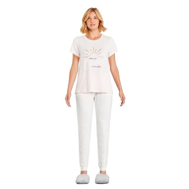 George Women's Hacci Pajamas 2-Piece Set with a white short-sleeve crew neck tee featuring a sunrise graphic and 'Wake Up Is Calling' text, paired with light grey printed jogger pants with fitted cuffs and an elasticized drawstring waistband, styled with grey slippers on a white background.