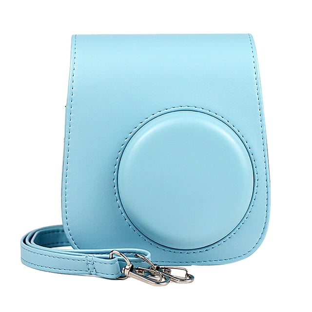 Leutsin Instant Camera Case for Instax Mini 11 in a solid light blue color, made of PU leather with a soft microfiber interior. The case features a rounded front design, a detachable flip cover for easy photo-taking, and an adjustable shoulder strap for convenient carrying. A back pocket is included for temporary photo storage.