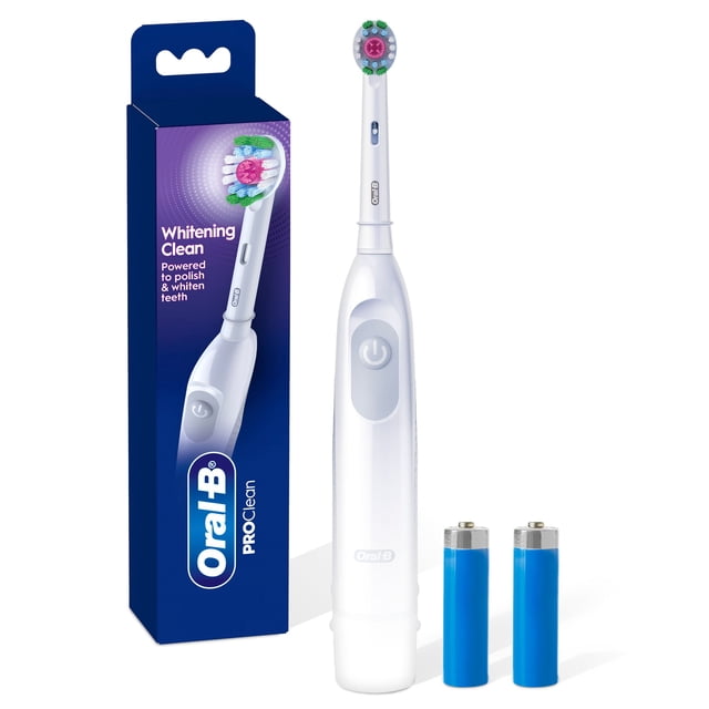 Oral B Pro Clean Battery Toothbrush in white with a 3D White round whitening brush head featuring x-shaped bristles, displayed upright next to its blue Oral-B Pro Clean packaging and two included AA batteries on a white background for effective plaque removal and teeth whitening.