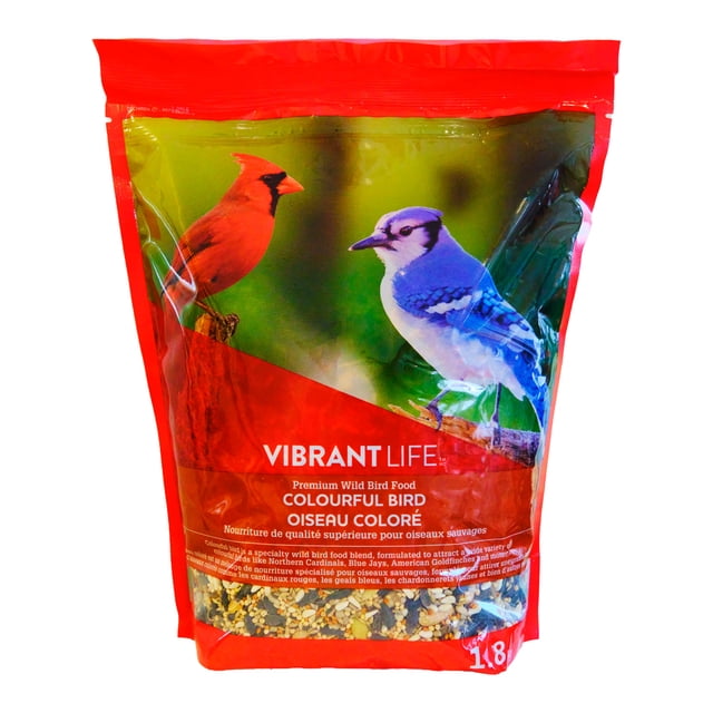 Vibrant Life Wild Bird Food Colourful Bird Blend 1.8kg resealable bag with red trim, featuring images of a red Northern Cardinal and a blue Blue Jay on a green background, containing a multicolour mix of seeds and grains to attract colourful wild birds year-round.