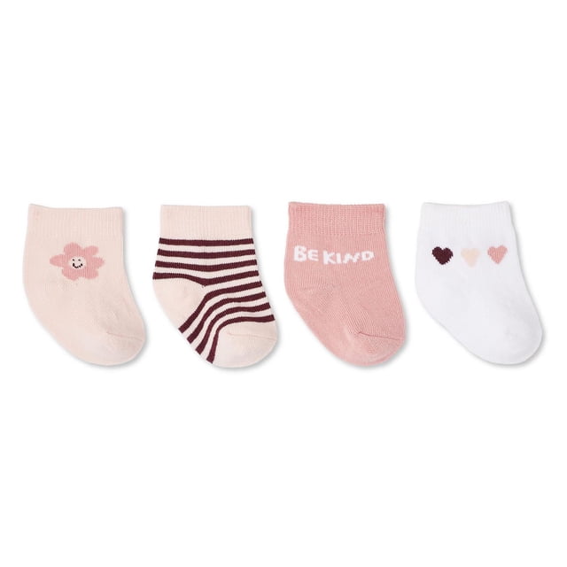George Baby Girls' Socks 4-Pack with four knit socks featuring ribbed cuffs in assorted designs: pale pink with a smiling flower, cream with dark brown stripes, dusty pink with 'BE KIND' text, and white with three small hearts in dark brown, light pink, and peach. Made from 76% BCI cotton, 22% polyamide, and 2% elastane, these one-size socks provide soft, comfortable wear for baby girls.