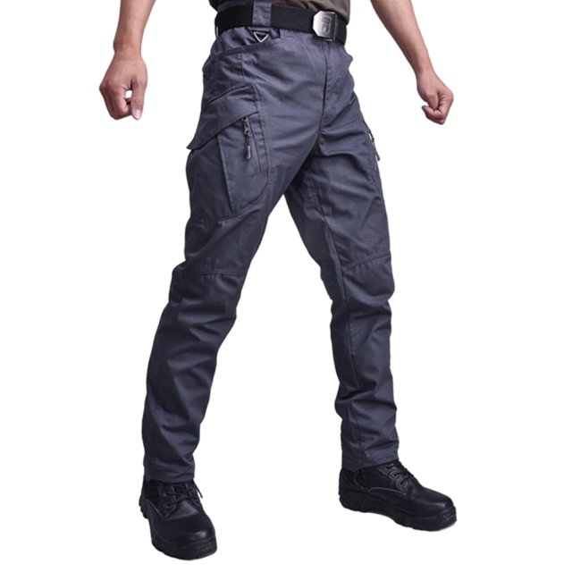 CVLIFE Men Tactical Pants Pantalon Cargo Décontracté pour la Randonnée et le Travail en Plein Air, Pantalon de Couleur Gris Foncé, avec Multiples Poches Zippées, Genoux Renforcés et Taille Élastique avec Boucles de Ceinture. Fabriqué en Mélange Respirant Polyester-Coton, Ce Pantalon Offre une Polyvalence pour les Activités de Plein Air comme la Randonnée et l'Escalade, Ainsi Qu'une Fonctionnalité de Tenue de Travail pour les Contextes Professionnels.