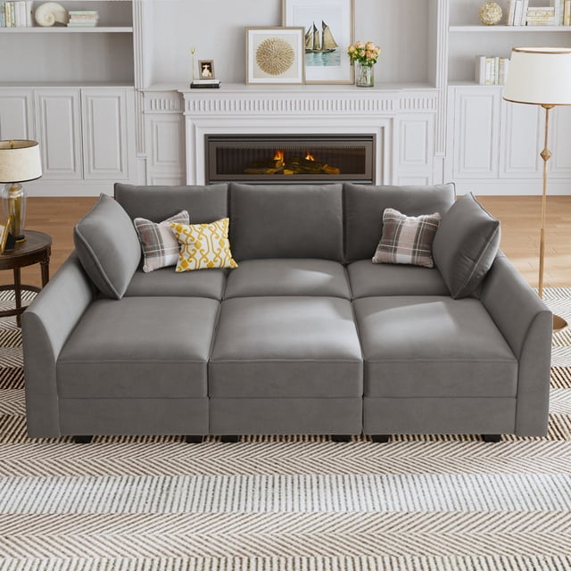 HONBAY Canapé Sectionnel Modulaire, Canapé-Lit convertible 6 Pcs en Velours Gris Terne, Conçu pour les Sièges de Salon. Comprend des Compartiments de Rangement Cachés, un design Modulaire flexible, un Tissu Adapté aux Animaux et des dimensions Spacieuses. Présenté dans un Salon Douillet avec des Coussins Décoratifs et un Foyer.