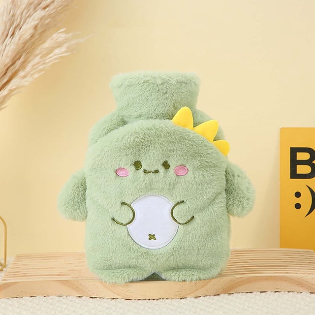 LSLJS Plush Hot Water Bag Explosion Proof Water Injection Bag Portable and Cute Hand Warming Treasure. A green plush hot water bottle with a cute dinosaur design, featuring embroidered facial details, yellow spikes, and a soft texture. Suitable for hot water therapy, relieving menstrual cramps, muscle pain, and providing warmth during cold nights. Positioned on a wooden surface with a neutral background.