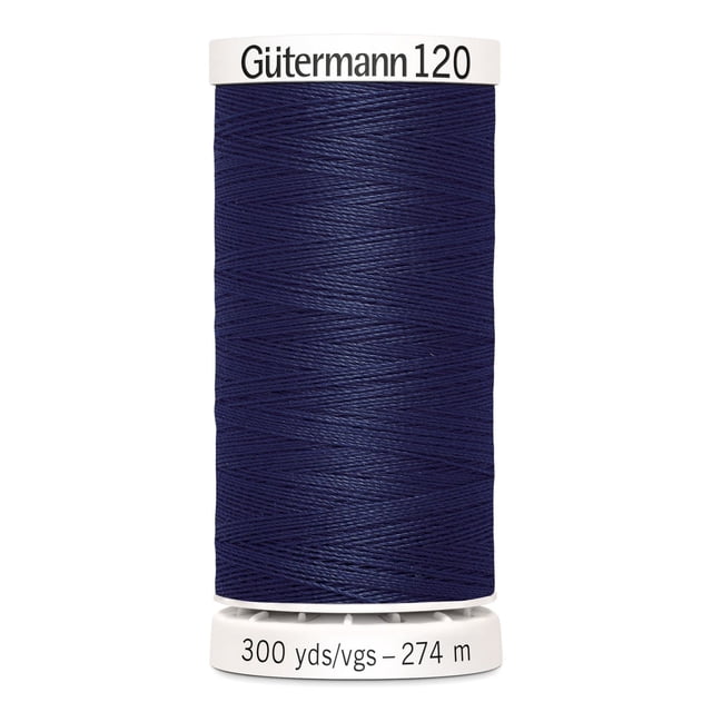 Gutermann 120 100% polyester all purpose thread spool in navy blue, tightly wound on a white plastic spool labeled with brand and 300 yards (274 meters) length, suitable for machine and hand sewing woven, knit, and synthetic fabrics, also ideal for craft and mending projects.