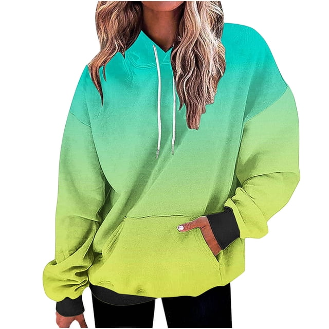 Besolor Oversized Sweatshirt for Women Fall Plus Size Long Sleeve Gradient Color Hoodies Baggy Clothes for Ladies. The image shows a long-sleeve hoodie with a gradient color design transitioning from teal to yellow. It features a drawstring hood, kangaroo pocket, and ribbed cuffs. The sweatshirt has a loose, oversized fit, ideal for pairing with leggings or jeans. Made of soft polyester material, it offers warmth and comfort for cooler months.