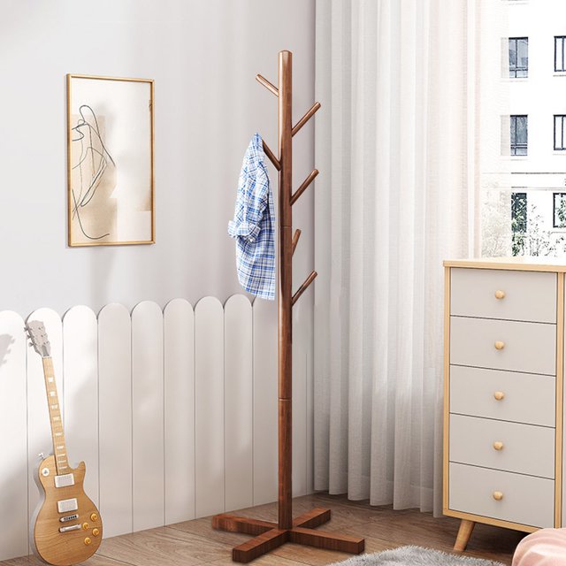 Lksixu Wooden Coat Rack, a free-standing coat tree with 6 hooks and 3 adjustable heights, crafted from sturdy brown wood. Ideal for entryways, hallways, bedrooms, or offices, the rack features a reinforced base and smooth hooks for hanging coats, hats, and bags. Displayed in a modern room with a white dresser and guitar, it blends functionality with style.
