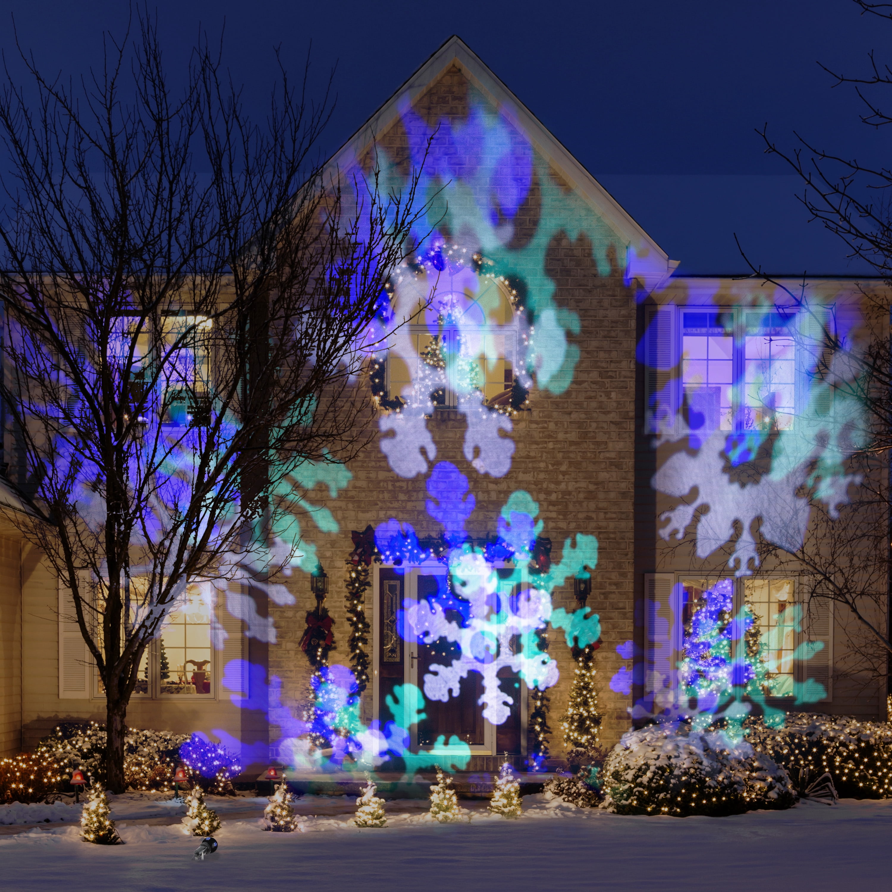 Illuminations du spectacle de lumières de Noël, scintillement de couleurs, flocons de neige, projecteur portable