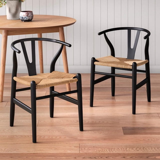 Heavenly Collection Wood Dining Chair SET OF 2 with black ash wood frames and beige braided rope seats, featuring curved armrests and sturdy design, placed on light hardwood flooring near a round wooden dining table, also ideal for casual seating in living spaces.